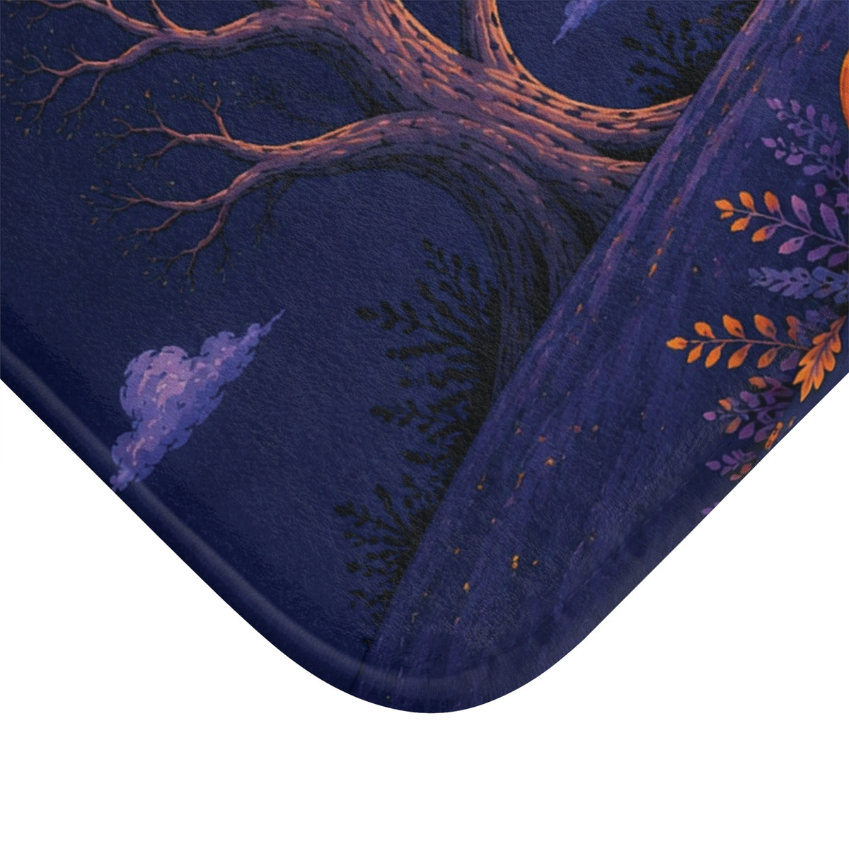 AmazerBath Halloween bath mat corner with haunted house, full moon, and glowing pumpkins, vivid print, soft texture, and a bound edge.