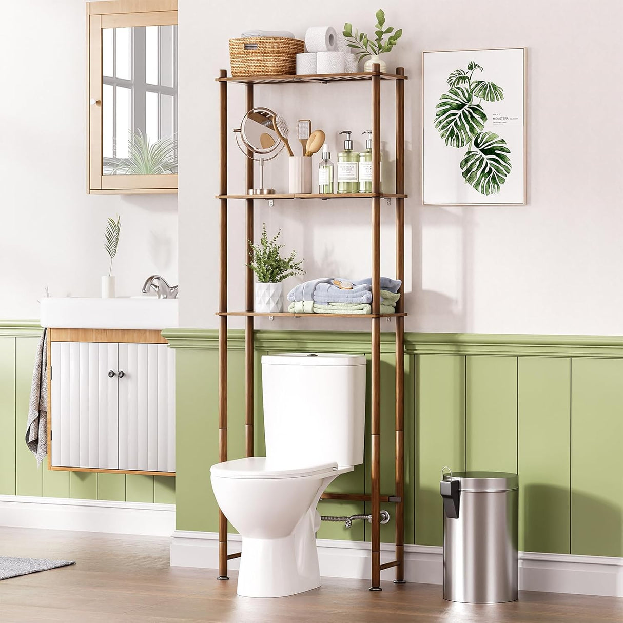 Bathroom with a bamboo over-the-toilet shelf, plant, and decorative items.