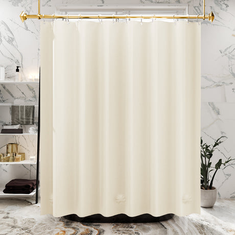 Beige shower curtain hanging in a bathroom with marble walls and a plant.