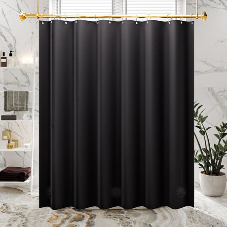 Black shower curtain hanging in a bathroom with marble walls and a plant.