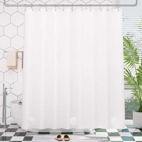 Peva white shower curtain liner in a bathroom with hexagonal tiles and a plant.