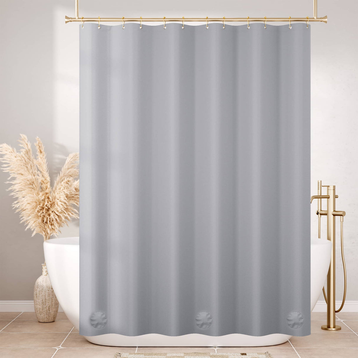 Gray shower curtain in a bathroom with a bathtub and decorative elements.