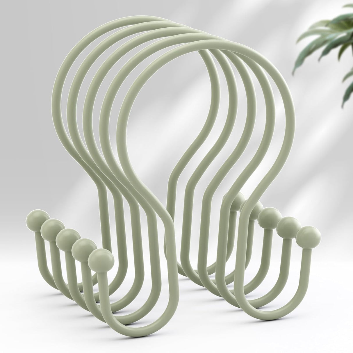 Set of light green hooks on a white background