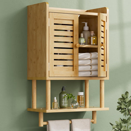 Bamboo wall-mounted cabinet with shelves against a green wall