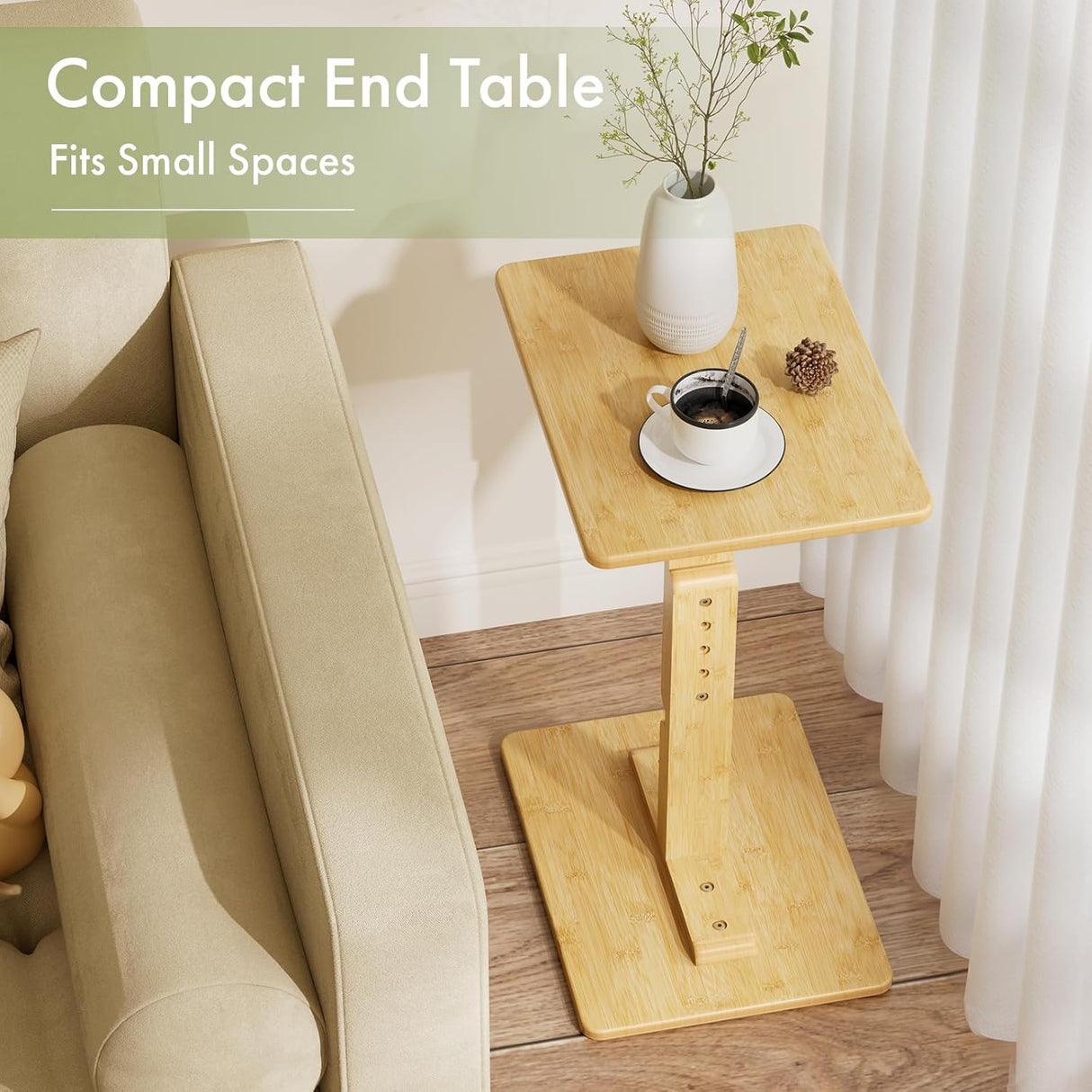 Compact bamboo end table with a cup of coffee and decorative items next to a beige sofa.