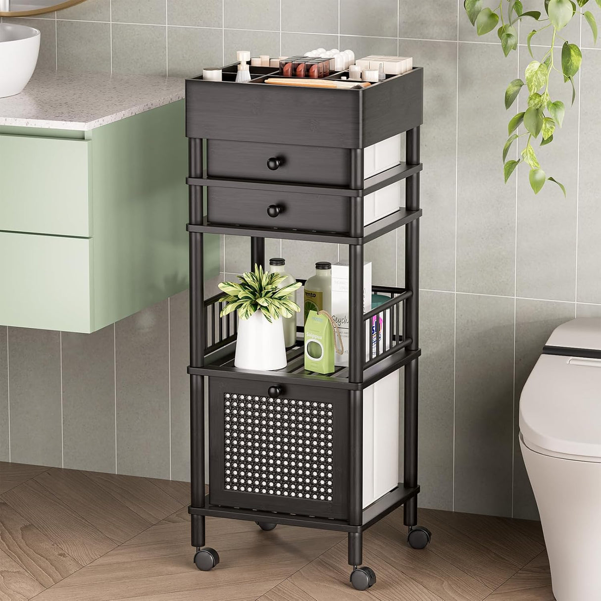 Black rolling cart with storage drawers and shelves in a bathroom setting.