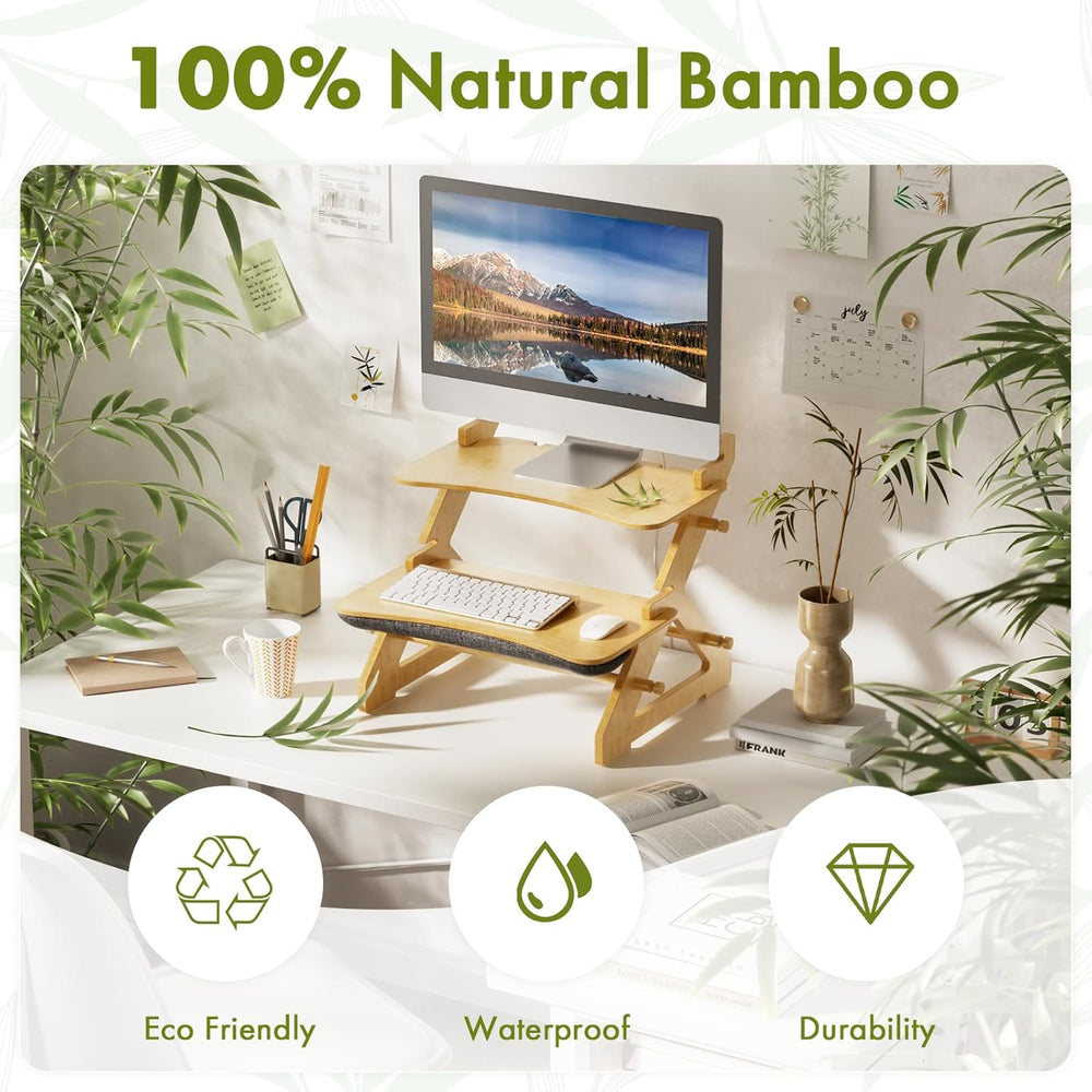 Bamboo desk setup with computer monitor, keyboard, and office supplies in a home office setting.