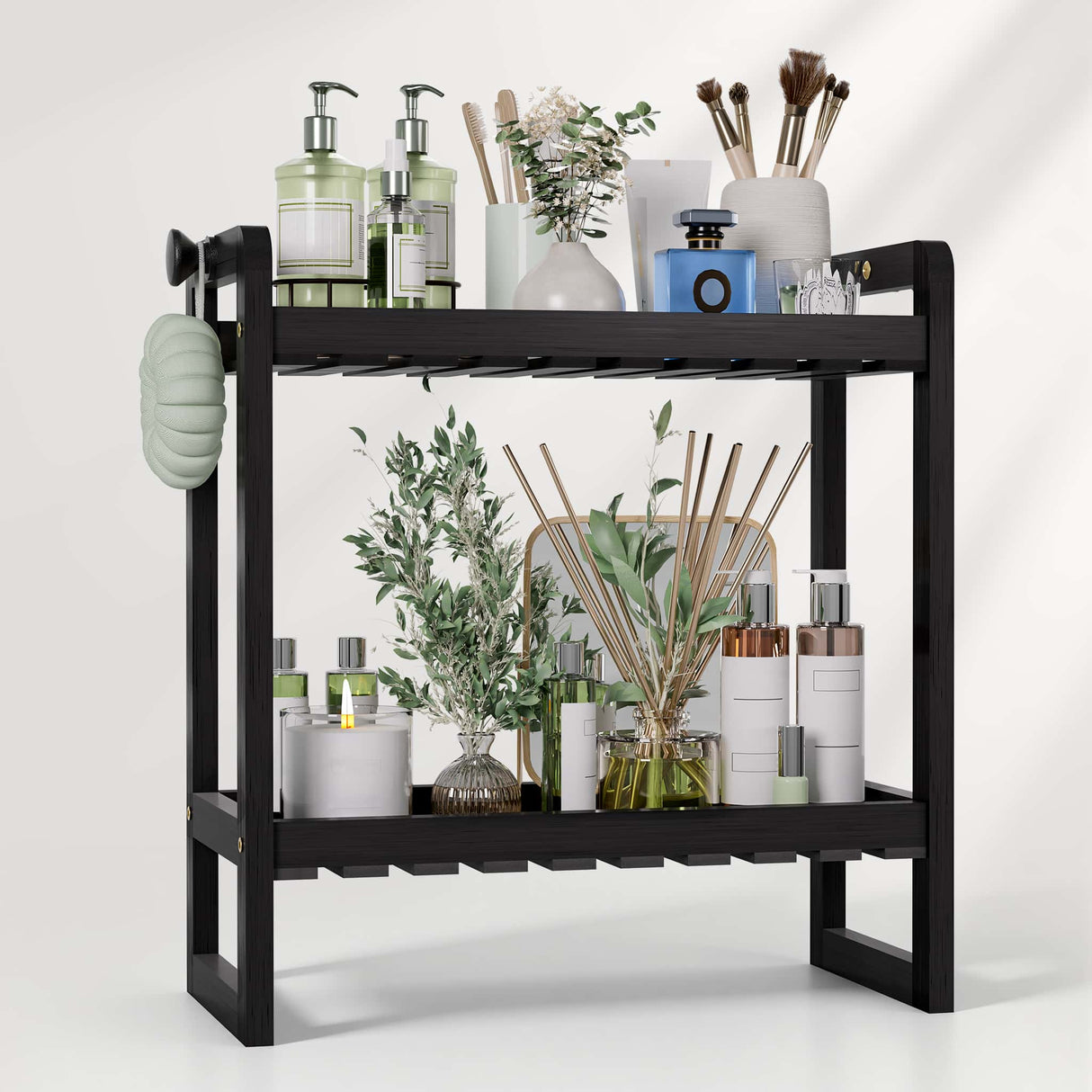 Black two-tier shelf with various items including bottles, plants, and decorative objects on a white background