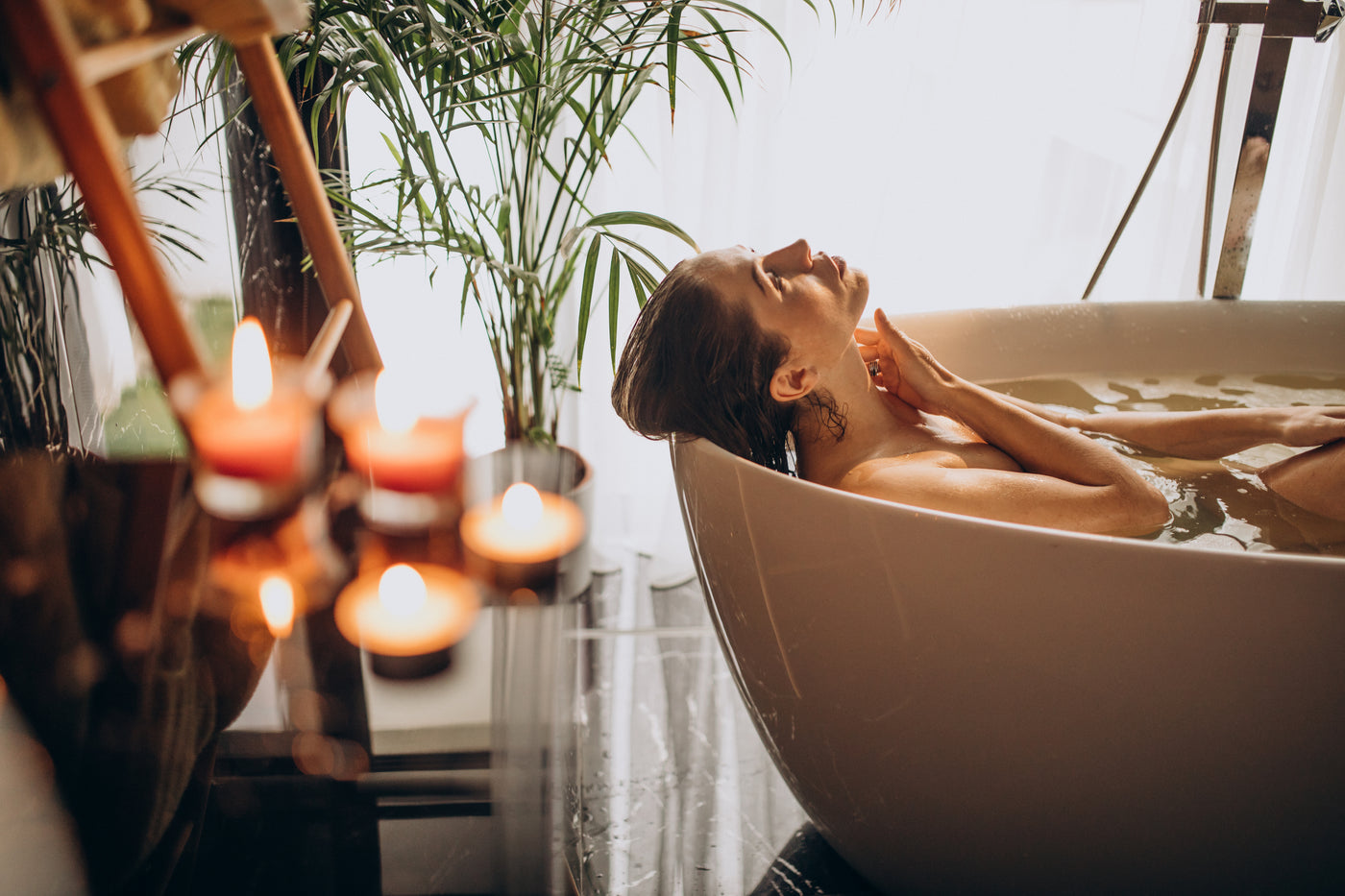 Woman relaxing bath with bubbles