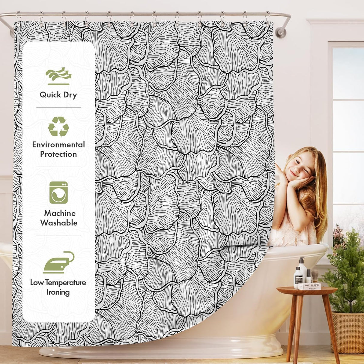 Shower curtain with black floral pattern and product features on the side, in a bathroom setting.