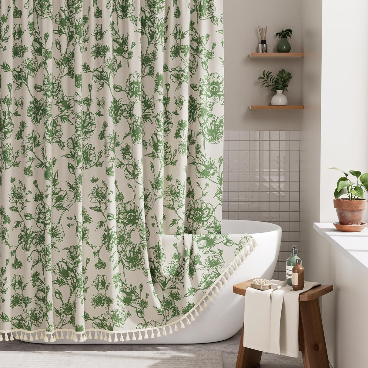 Bathroom with a green floral shower curtain, white bathtub, and wooden stool.