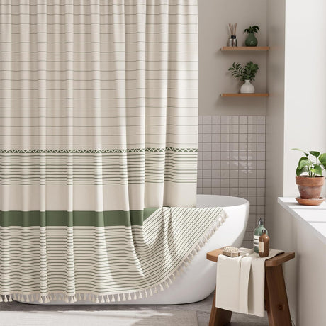 Striped shower curtain with green and white pattern in a bathroom setting.