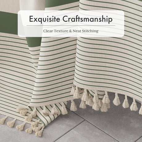 Striped fabric with tassels on a tiled floor, emphasizing craftsmanship.