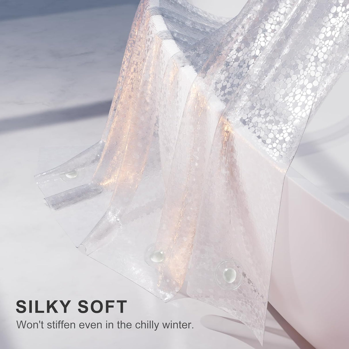 Close-up of a EVA shower curtain liner, labeled 'Silky Soft' on a light background.