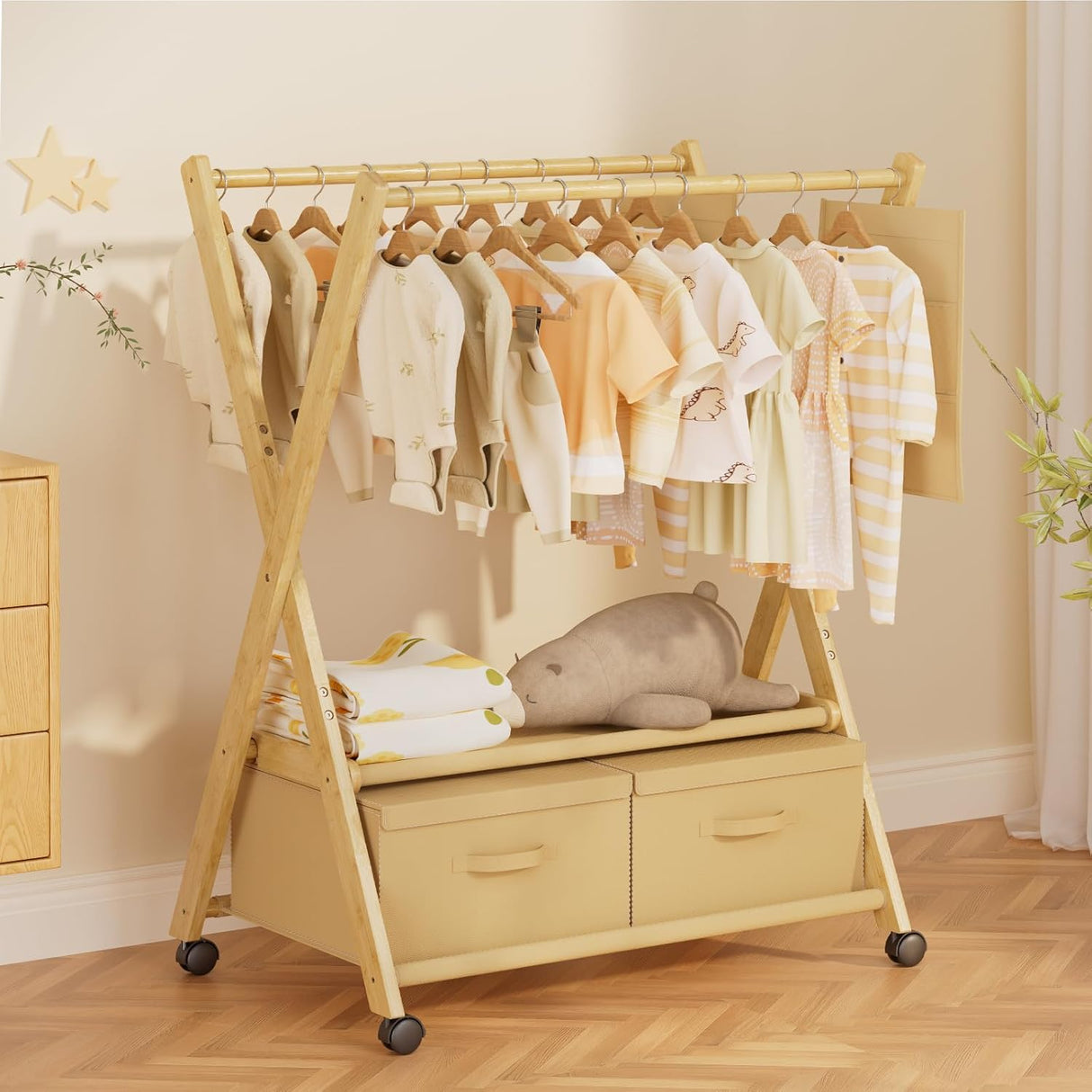 Wooden clothing rack with baby clothes and toys in a nursery setting