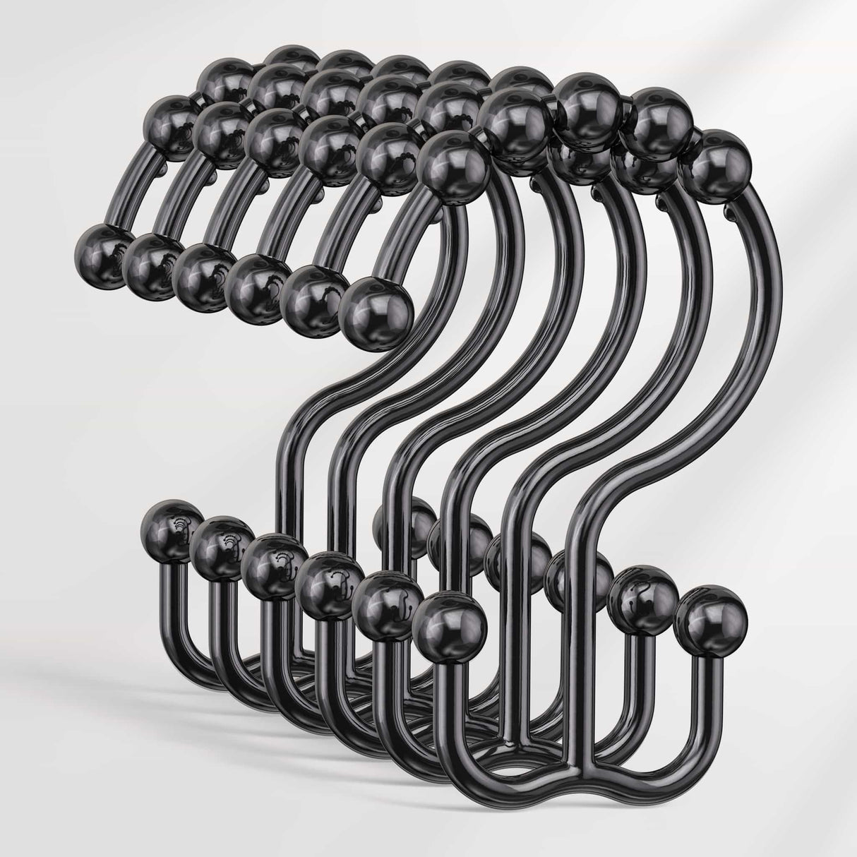 Set of black hooks with spherical ends on a white background