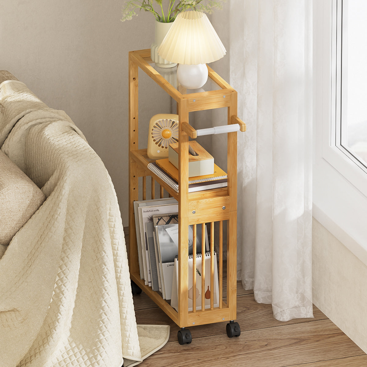 Bamboo rolling cart with books and a lamp in a room setting