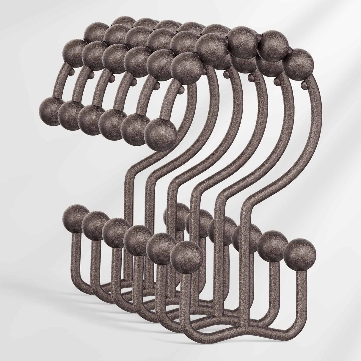 Set of metal hooks with spherical ends on a white background