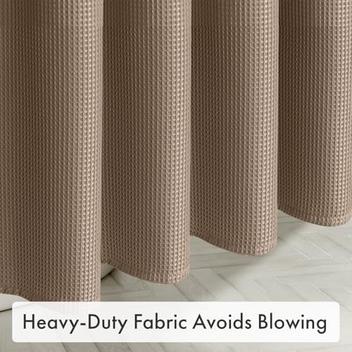 Heavy-duty AmazerBath taupe waffle shower curtain hanging smoothly to help reduce billowing in the bathroom.