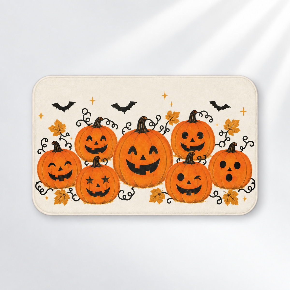 Pumpkin patch Halloween bath mat with jack-o'-lanterns and bats on a light gray background