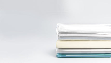 Clear shower curtain liners displayed in multiple thicknesses from lightweight to heavy duty