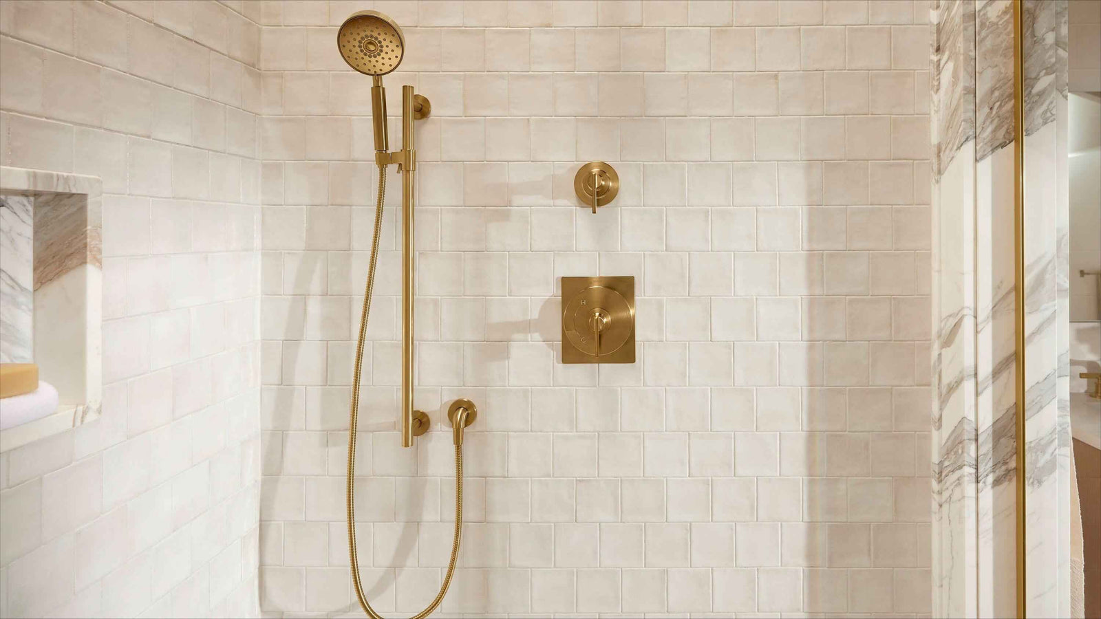 Frameless glass shower door with clear bottom and side seals controlling water
