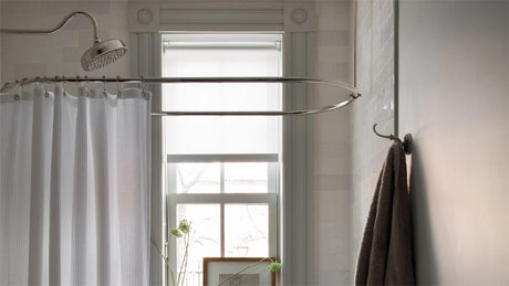 Bright rental bathroom refreshed with a shower curtain, bamboo storage, and removable accessories