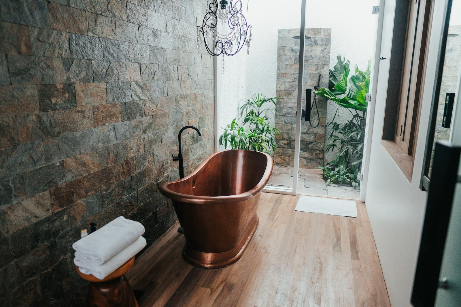 Eco-friendly bathroom with natural materials, plants, and water-saving fixtures