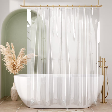 Clear shower curtain with a white bathtub and decorative elements in a bathroom setting