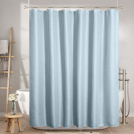 Waffle blue shower curtain in a bathroom setting with a toilet and bathtub.