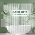 Pack of 2 clear shower liners with a green background and bathtub.