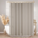 Khaki shower curtain liner in a bathroom with a bathtub and decorative elements.