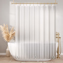 White shower curtain in a bathroom with a bathtub and decorative elements.