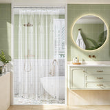 Modern bathroom with shower area, sink, and round mirror.