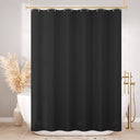 Black shower curtain in a bathroom setting with decorative elements.
