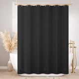 Black shower curtain in a bathroom setting with decorative elements.