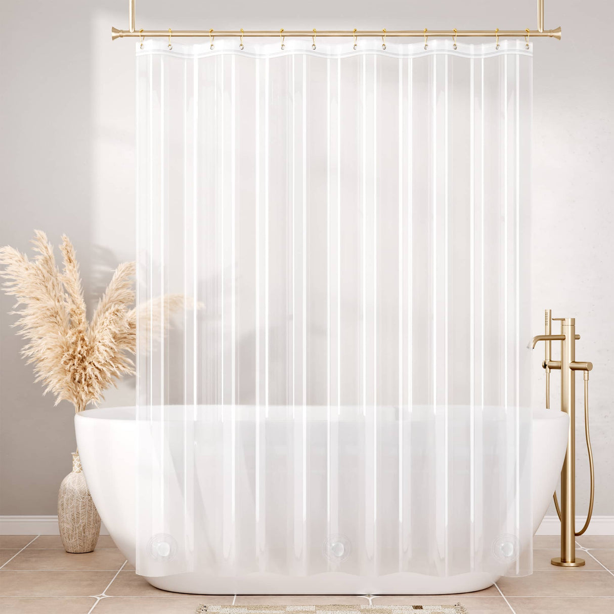 White shower curtain with gold fixtures in a bathroom setting