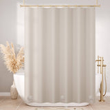 Beige shower curtain in a bathroom with a bathtub and decorative elements.