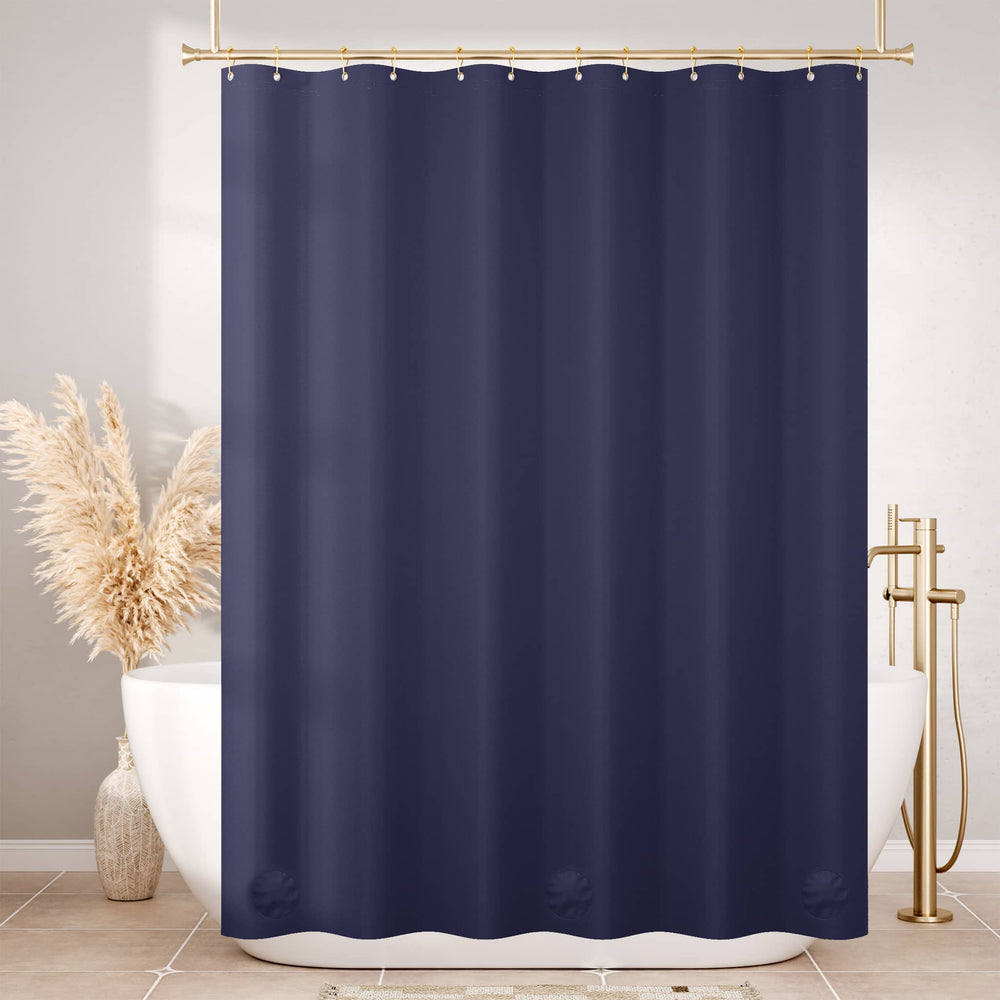 Navy blue shower curtain in a bathroom setting with a bathtub and decorative elements.