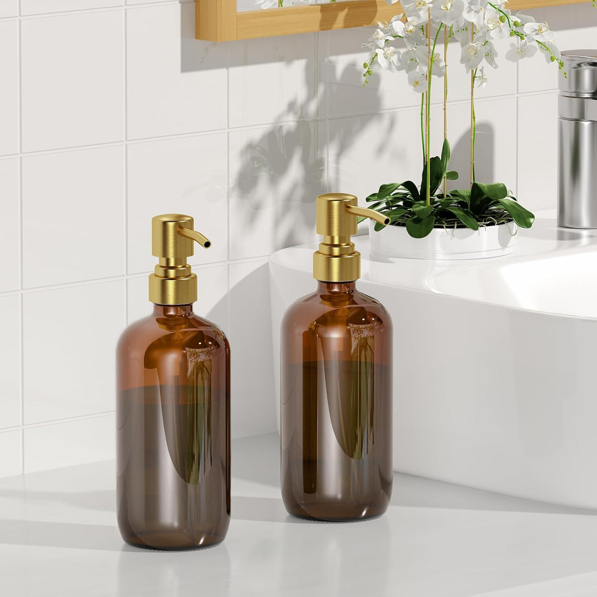 Two brown glass bottles with gold pumps on a bathroom counter.