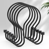 Set of black metal hooks on a white background