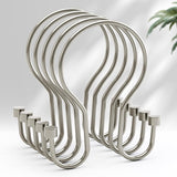 Set of metal hooks on a light gray background