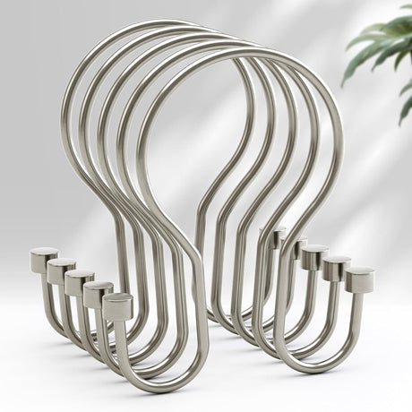 Set of metal hooks on a light gray background