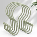 Set of light green hooks on a white background