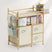 Storage rack with shelves and drawers containing various products on a white background