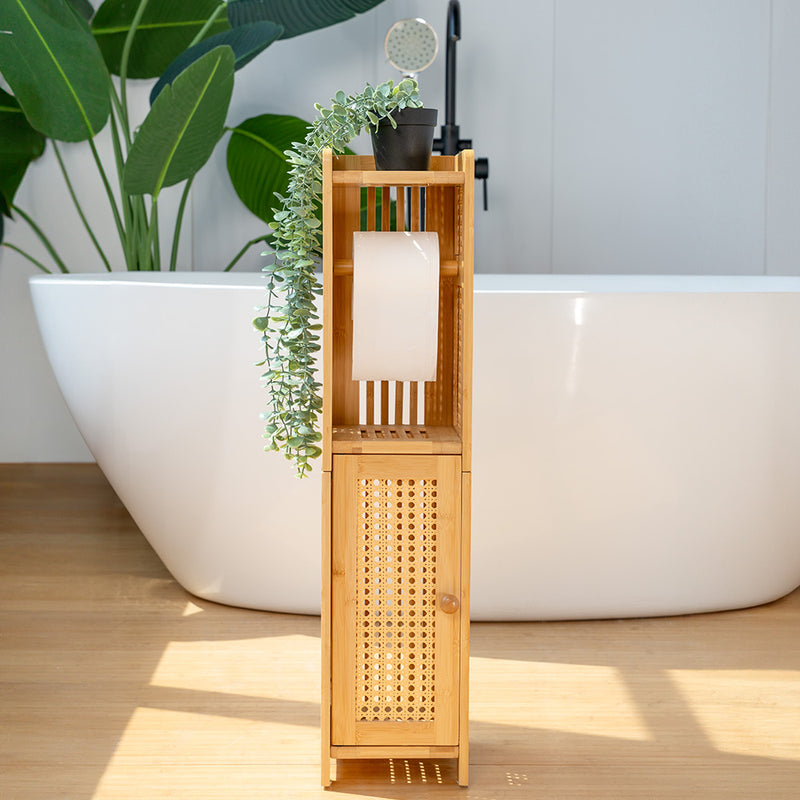 Bathroom with a bamboo wooden shelf, white bathtub, and potted plant
