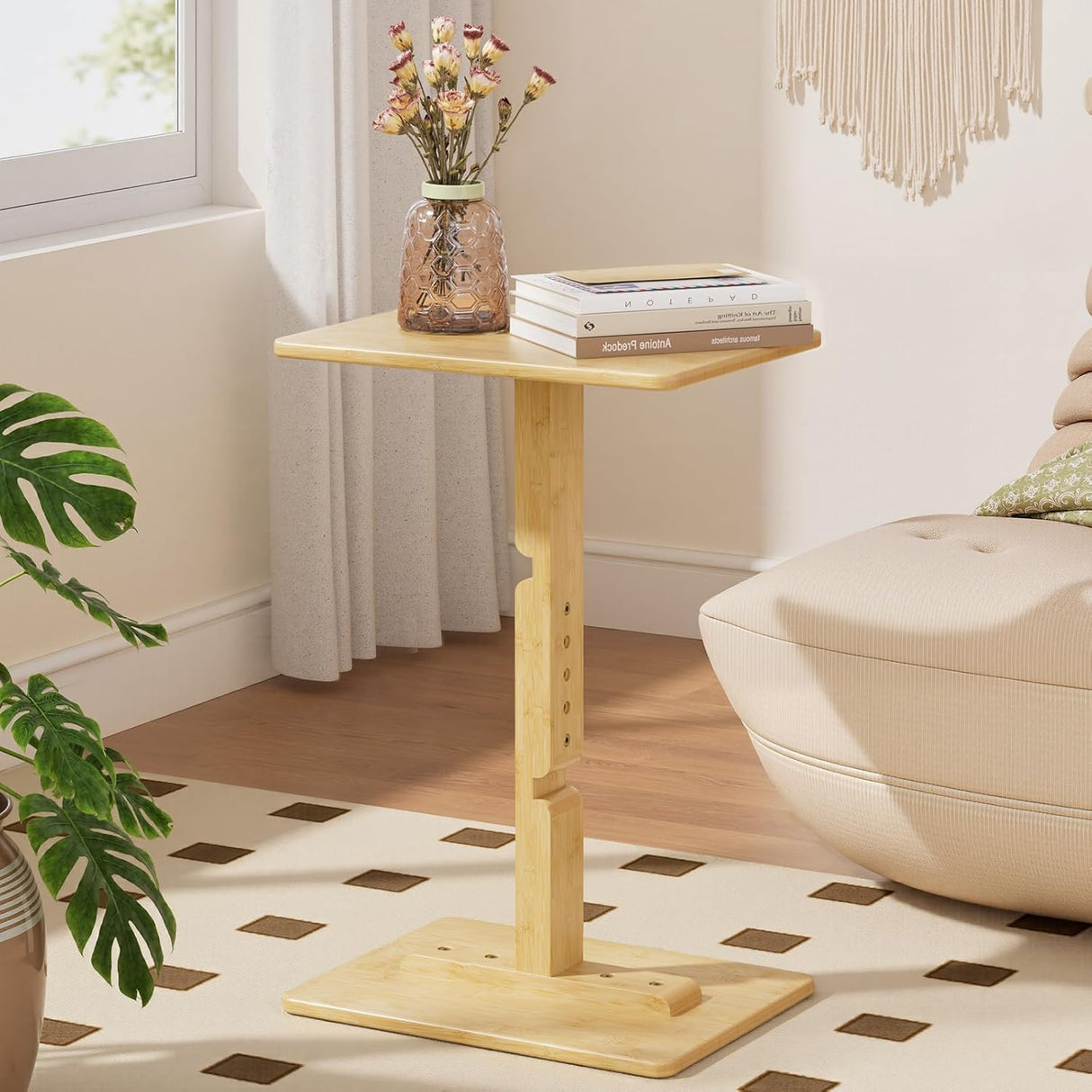 Wooden side table with books and a vase in a living room setting