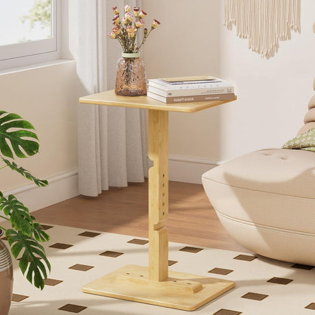 Wooden side table with books and a vase in a living room setting