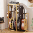 Guitar stand with multiple guitars and a amplifier in a room setting.