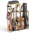 Bamboo wooden guitar stand holding various guitars and a mixer on a white background